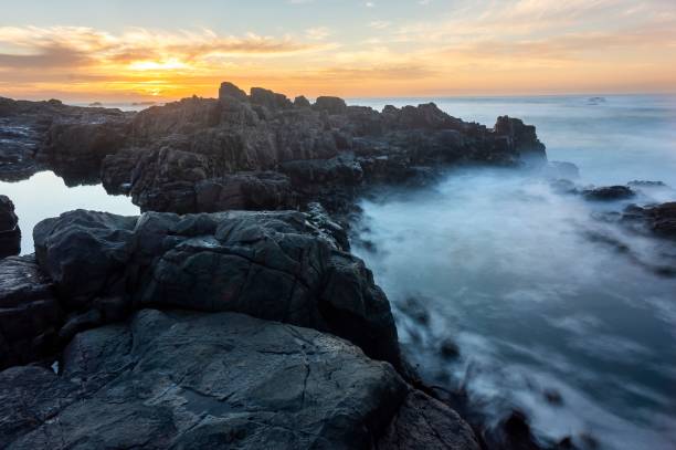 istock Beautiful view of a sea with rocky cliffs at sunset 1438574493