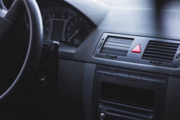 istock Interior of a car with a steering wheel and a speedometer 1438574832