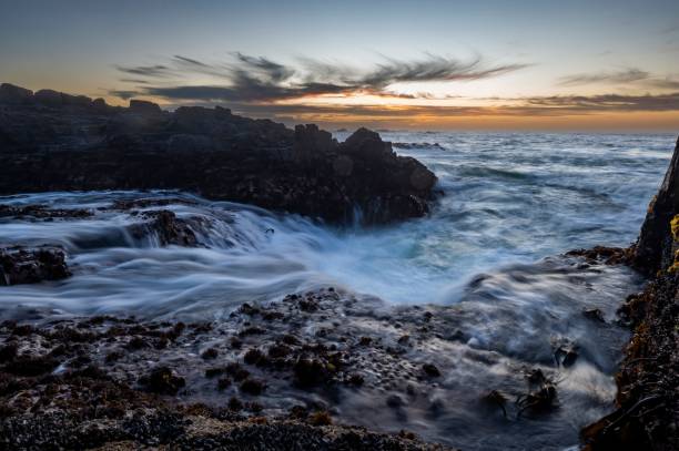 istock Beautiful view of a sea with rocky cliffs at sunset 1438574863