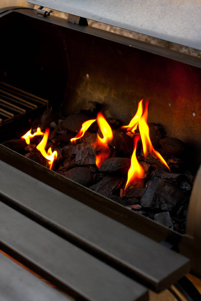 istock Charcoal burning in a metal container 1438575282