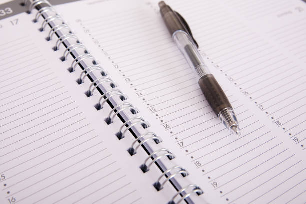 istock High angle shot of a pen on an open notebook 1438575285