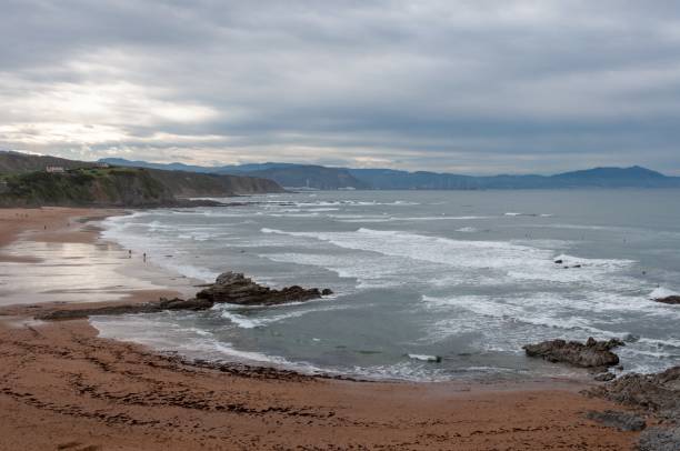 Beautiful view of the sandy The Sopelana beach in Vizcaya, Spain on a rainy day The beautiful view of the sandy The Sopelana beach in Vizcaya, Spain on a rainy day sopelana stock pictures, royalty-free photos & images