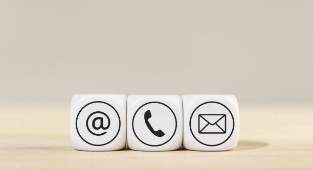 istock Contact us icons on white cube blocks 1438577321