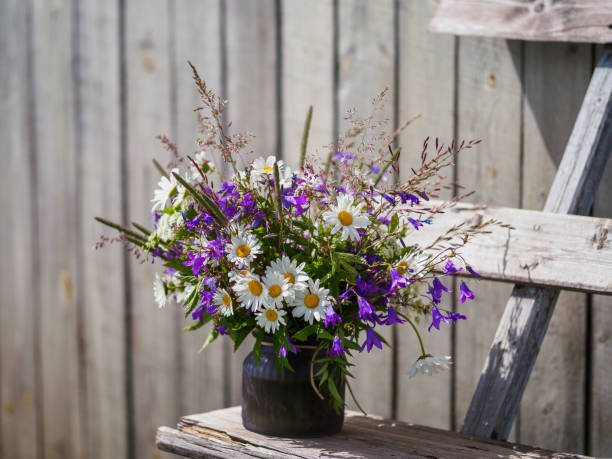 istock Bouqet with wild flowers. Cottagecore concept 1438578920