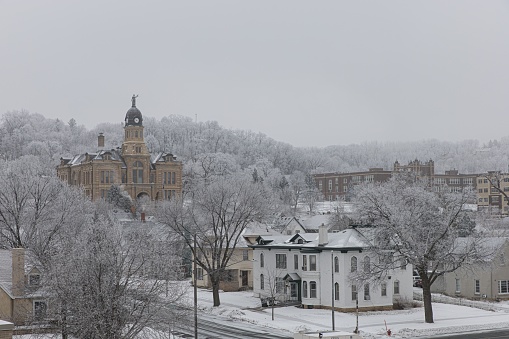 Winter scenery with a view of Mankato courthouse and hill in frozen fog frost, MN, USA