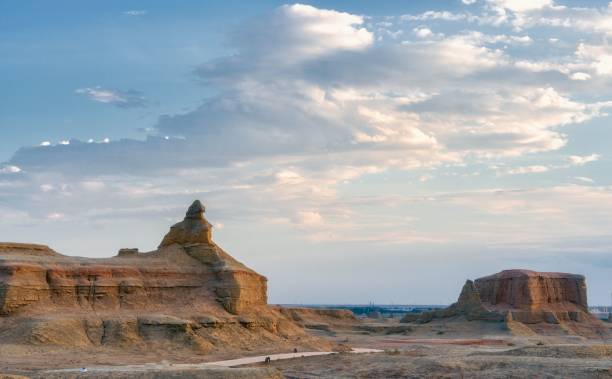 istock Rock formations on landscape against cloudy sky 1438581770