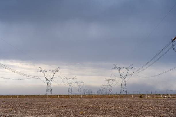 istock Masts of the power line against the cloudy sky 1438582014