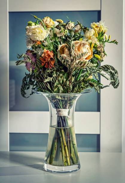 A beautiful and colorful bouquet inside a vase on a table