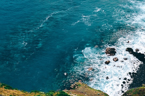 A high angle shot of beautiful sea waves in Madiera, Portugal