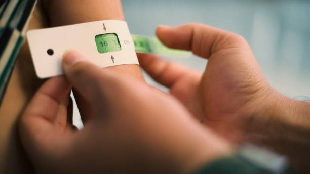 istock A doctor examines children's malnutrition inside a refugee camp. 1438583764