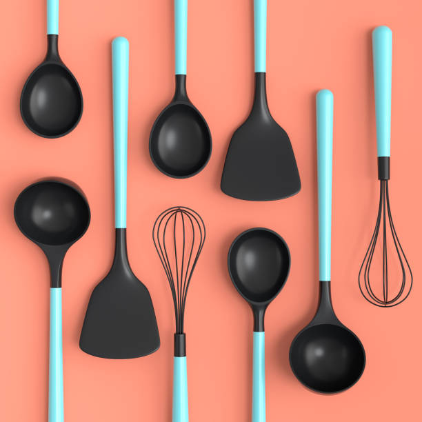 istock Wooden kitchen utensils, tools and equipment on coral background. 1438585226