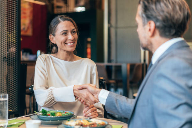istock Business handshake at the restaurant 1438587051