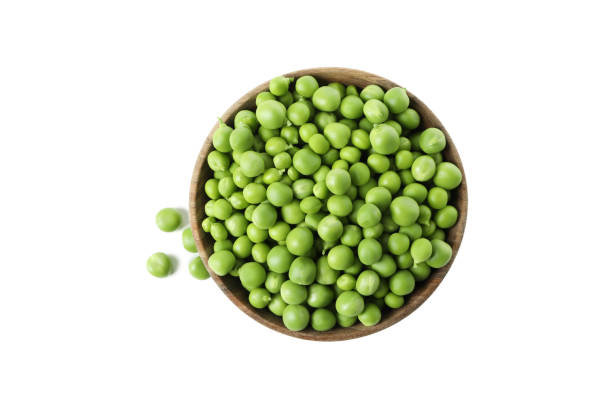 istock Bowl with pea seeds isolated on white background 1438588788