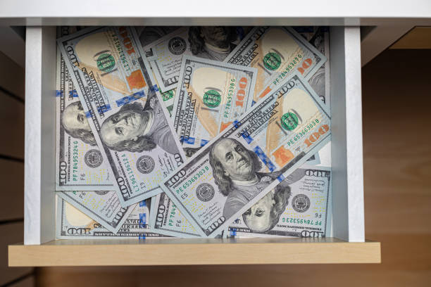 istock a hundred dollar bill is in a drawer. 1438590390