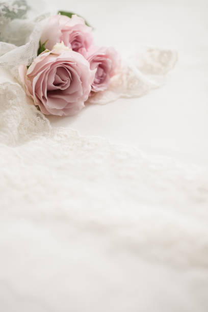 Wedding bouquet, pink roses, flowers, lace fabric, white background