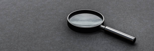 istock Magnifier Glass on Dark Background with Copy Space 1438592972