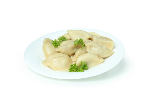 istock Plate with vareniki or pierogi isolated on white background 1438594648