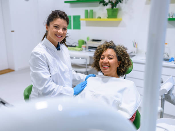 istock Dentists and patient at dental clinic office 1438594976
