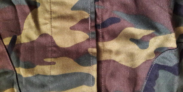 istock Camouflage fabric texture background.Military uniform pattern. Abstract background and texture. 1438598856