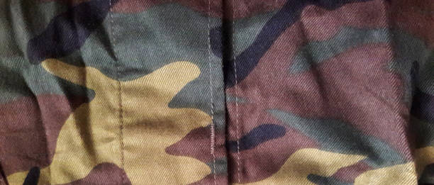 istock Camouflage fabric texture background.Military uniform pattern. Abstract background and texture. 1438598922