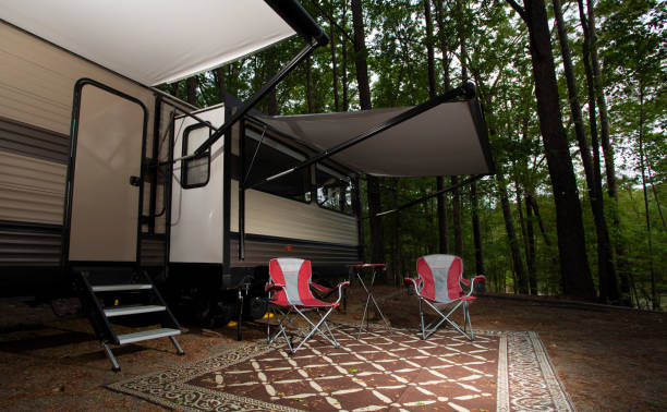 istock Pair of chairs at a campter trailer campsite 1438600788