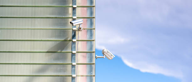 istock Surveillance Cameras On Glass Facade 1438600910
