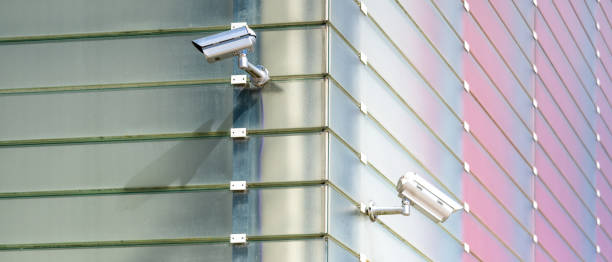 istock Surveillance Cameras On Glass Facade 1438601447