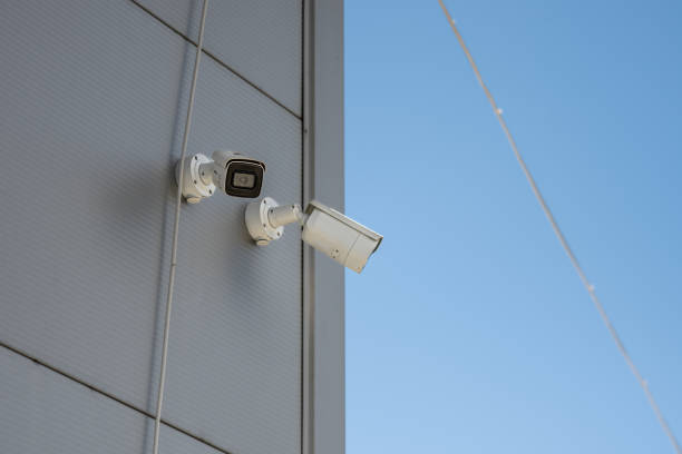 istock Surveillance Cameras On Glass Facade 1438601452