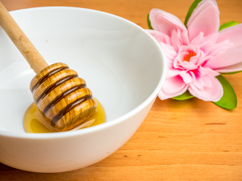 Honey dipper in a bowl