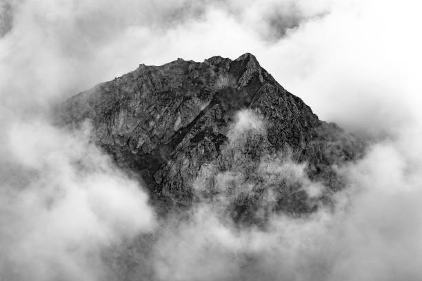 istock Top of a mountain in the clouds 1438604746