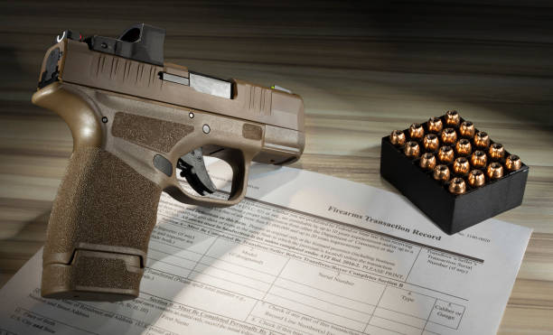 istock ammo with a gun and 4473 form 1438604857