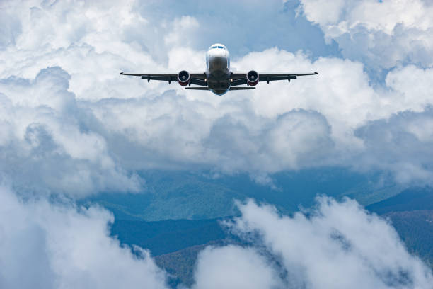 Flight of the passenger plane above the clouds.