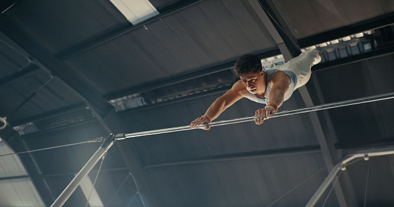 High jump, woman and fitness with exercise, sport and athlete in a competition outdoor. Jumping, workout and training for performance with action, energy and contest with female person and athletics