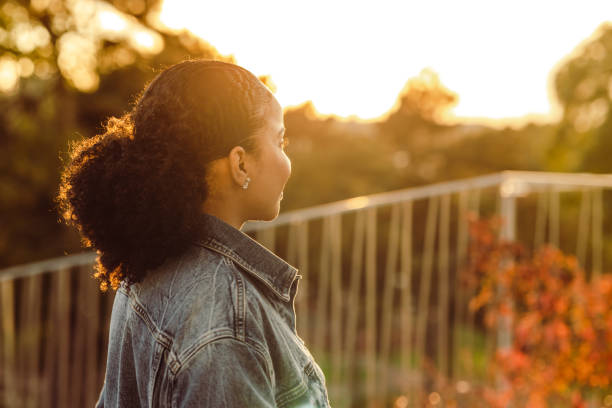 istock Young woman looking at the view and relaxing 1438606969