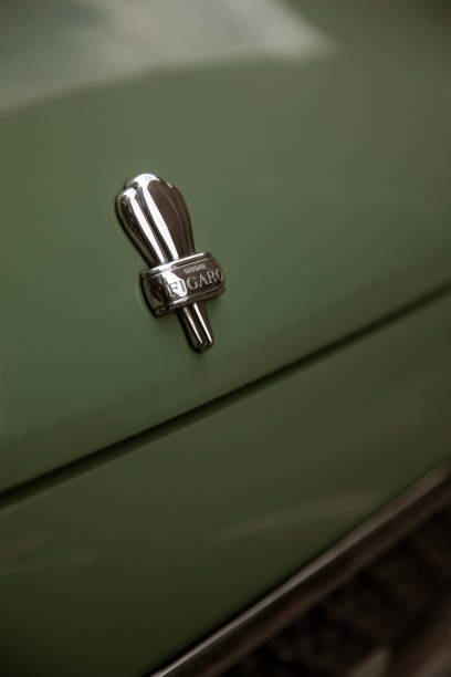 September 21, 2022: A Nissan Figaro parking near Tate Modern in London. The Nissan Figaro is a front-engine, front-wheel drive, two-door, 2+2, fixed-profile convertible manufactured by Nissan for model year 1991