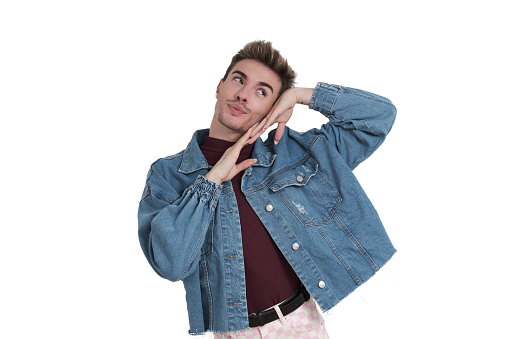 Young caucasian man smiling with his hands on his face, isolated on white background.