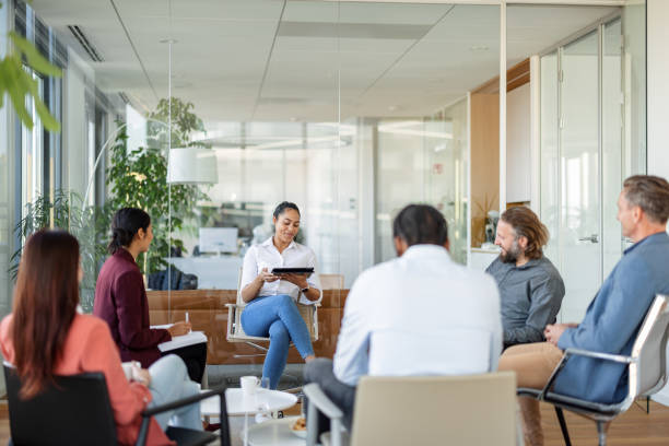 istock Multiracial Workers In A Meeting In The Board Room 1438610604