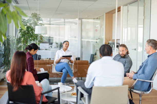 istock Young Dark-Skinned Woman Leading A Meeting At The Office 1438610607