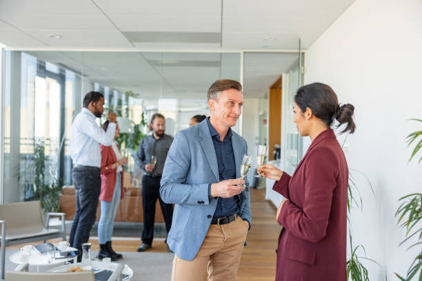 istock Mixed-race Female Young Worker Toasting With The CEO 1438610641