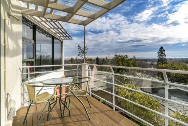 istock Small table with chairs in the balcony of a modern villa 1438610841