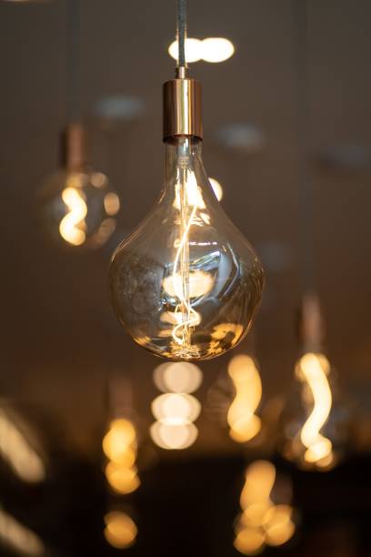 istock Vertical closeup of a lamp hanging from a wall 1438610892