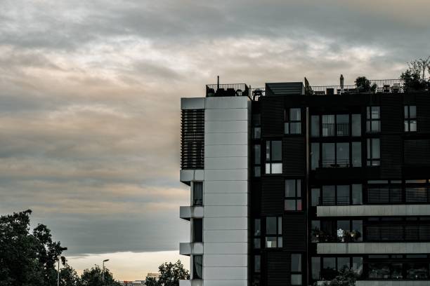 istock Big modern building with large windows in Paris against a gloomy cloudy sky 1438610912