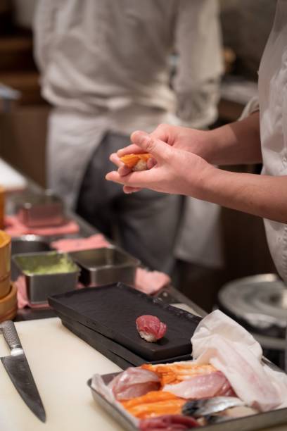 istock Chef making sushi in the restaurant 1438610932