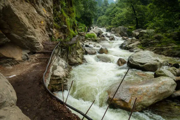 River flowing ( Barati Nala ) alongside Shrikhand Mahadev kailash Yatra trail through dense forest and Mountains. Himachal Pradesh India.