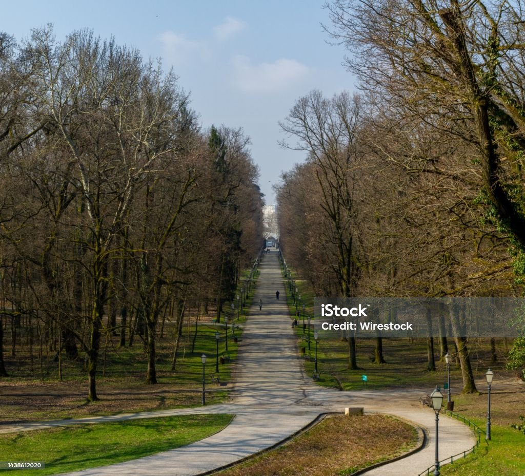 Maksimir park covered in pathways and trees under a blue sky in Zagreb in Croatia The Maksimir park covered in pathways and trees under a blue sky in Zagreb in Croatia Agricultural Field Stock Photo