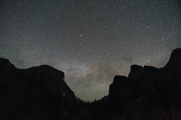 istock Low angle shot of a mountainous scenery under the magical night sky 1438612910