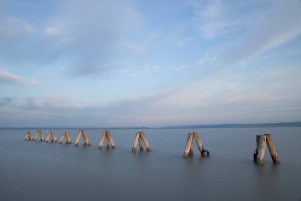 istock Pier in the sea under the beautiful cloudy sky during daytime 1438613216