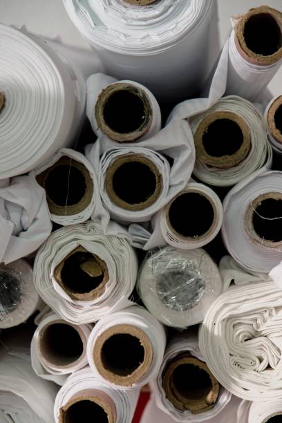 istock Lot of white textile rolls in a tailors studio 1438613903