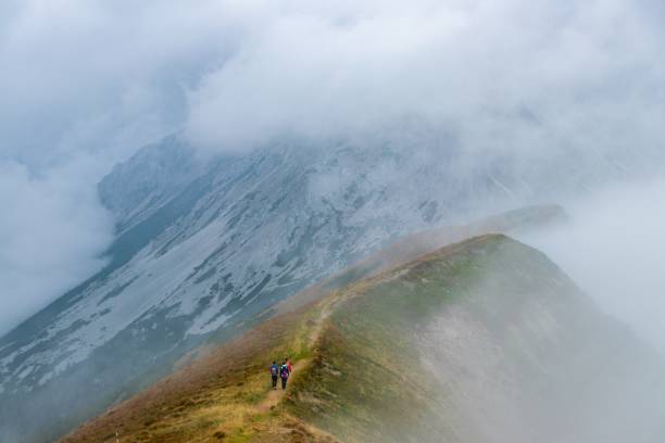 istock Hikers going up a mountain trauk 1438614796