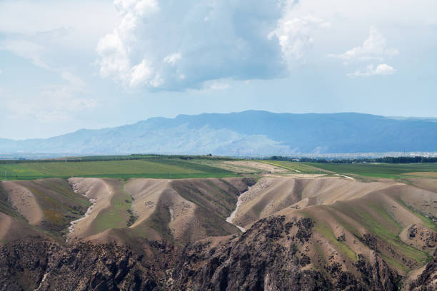 Grassland and mountains in a cloudy day. Shot in Xinjiang, China.